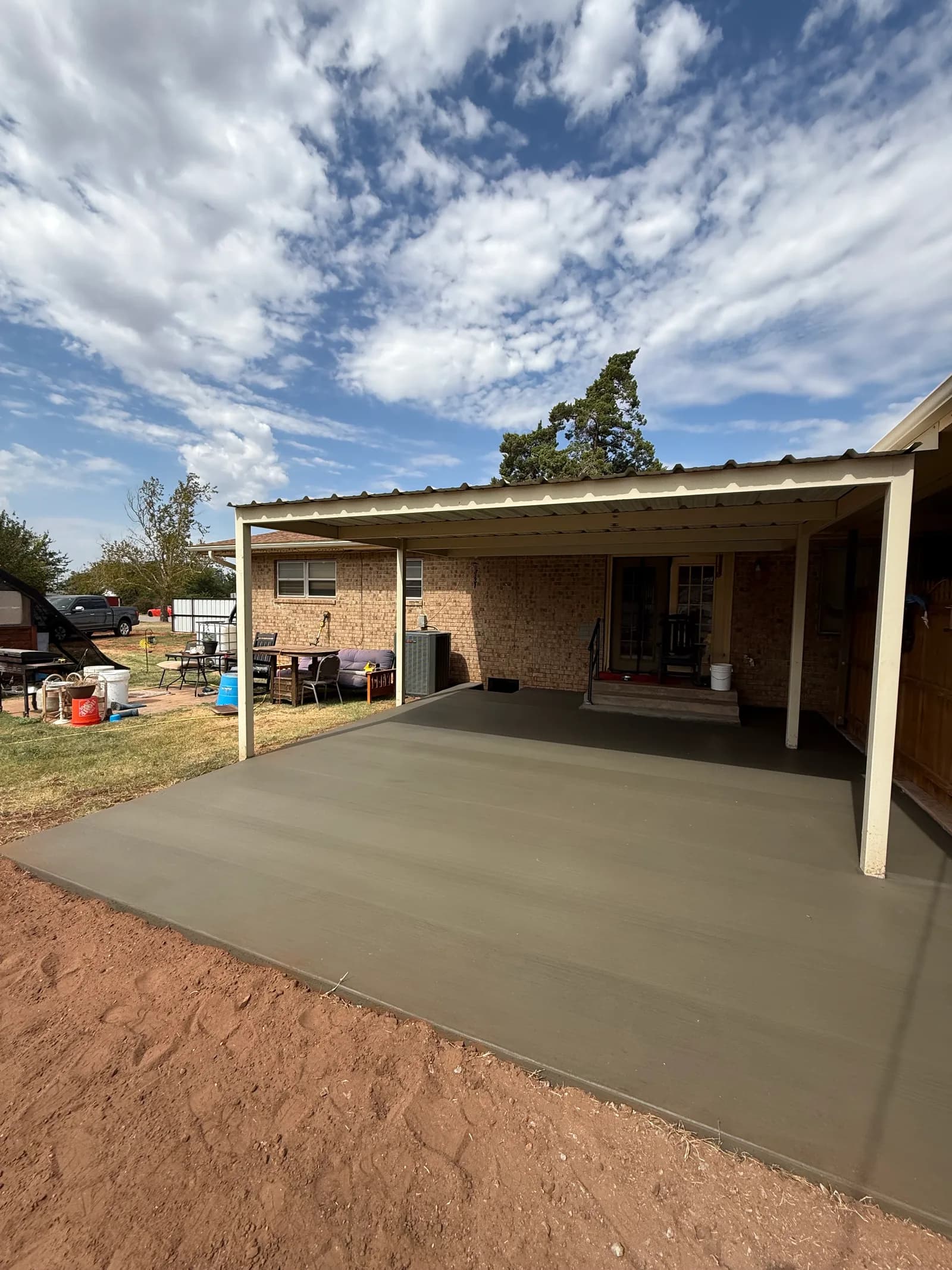 Crowell Backyard Concrete Patio — completed patio extending the outdoor living space in Crowell, TX