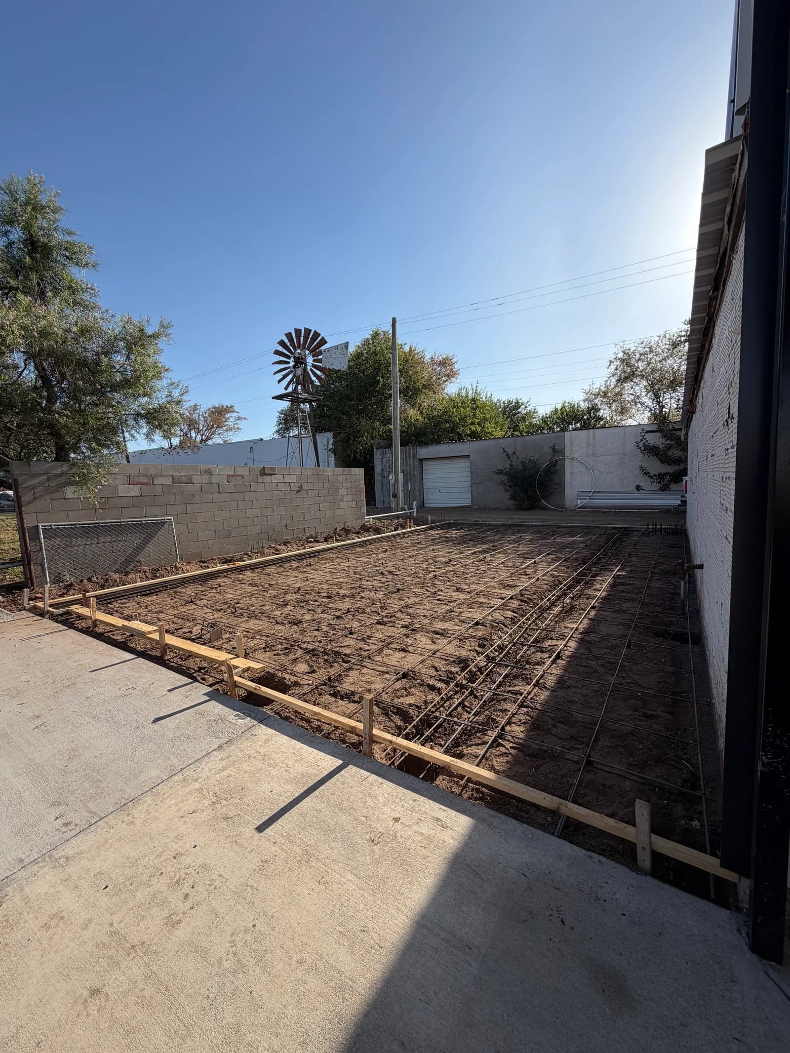 Vernon 24' x 40' Metal Building Foundation — forming and rebar beside the existing building in Vernon, TX