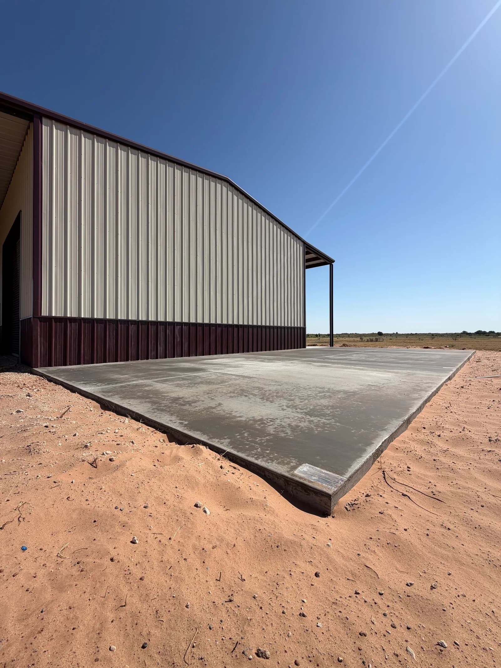 Vernon 24' x 52' RV Cover Foundation — full-length pad poured and finished level in Vernon, TX