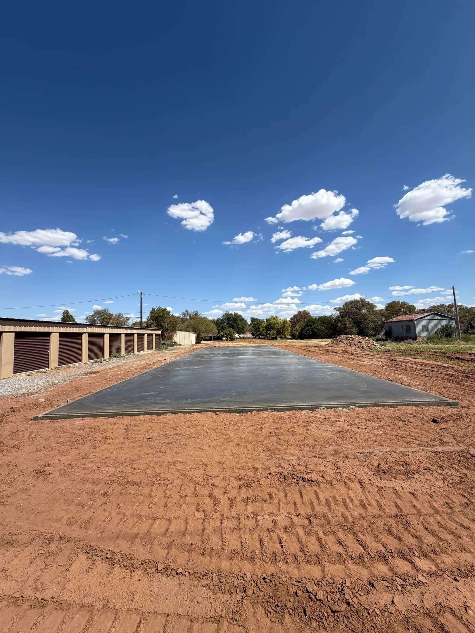 Childress 30' x 100' Storage Building Foundation — finishing the slab surface in Childress, TX