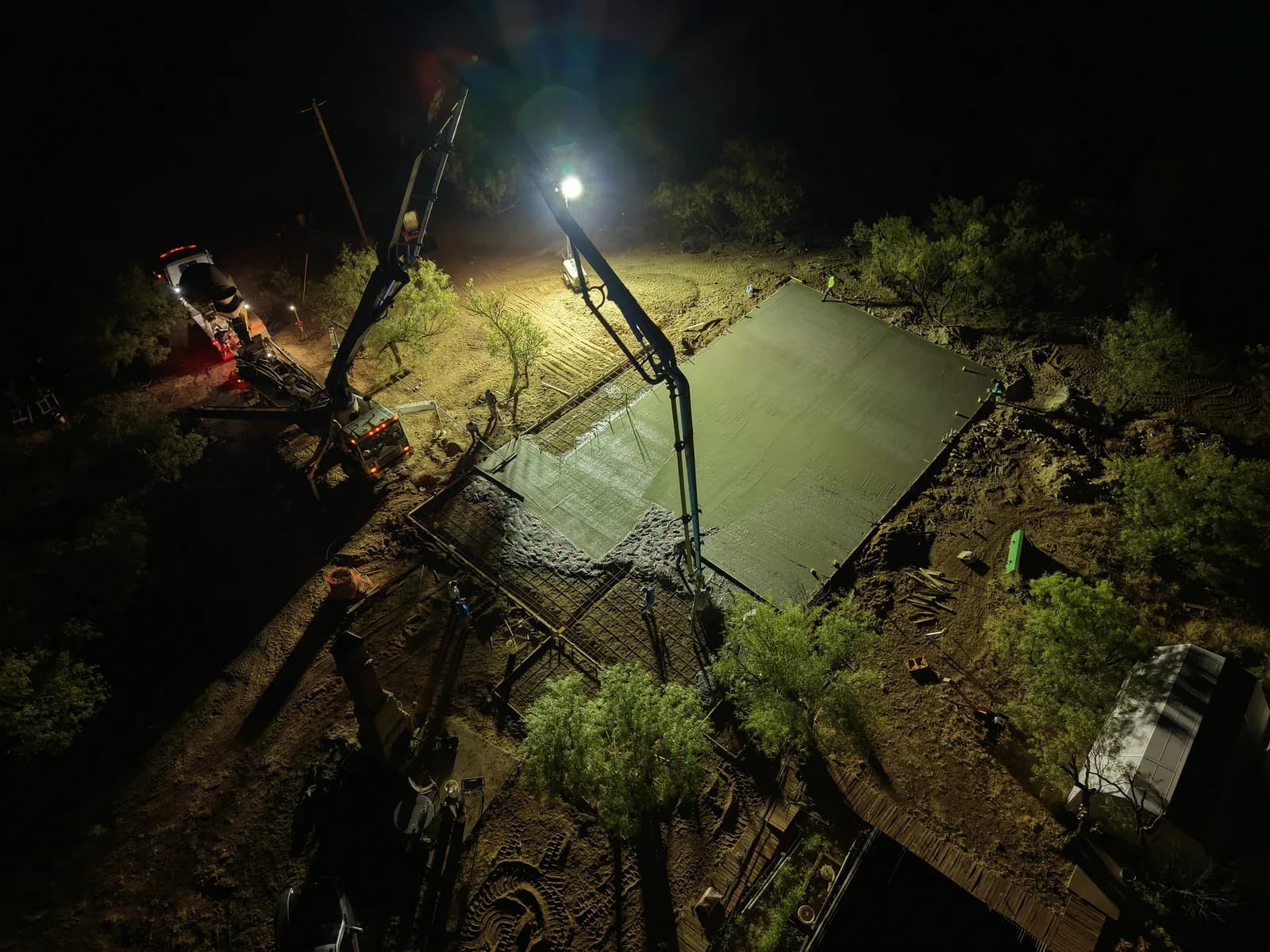 Quanah 40' x 80' Barndominium Foundation — boom pump placing concrete across the site in Quanah, TX