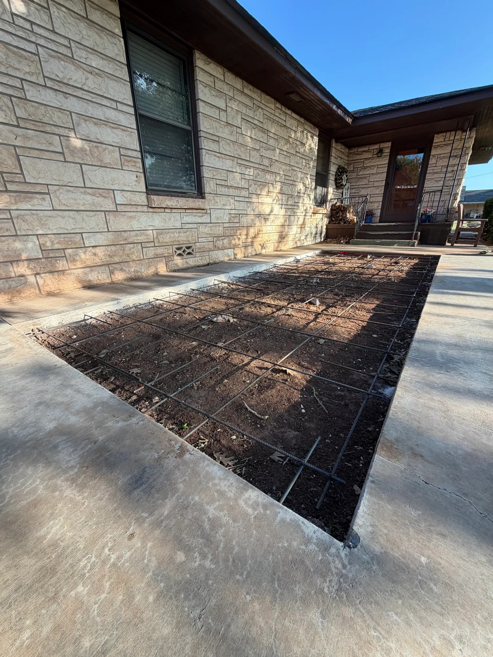 Crowell Concrete Driveway Addition — base grading and forming in Crowell, TX
